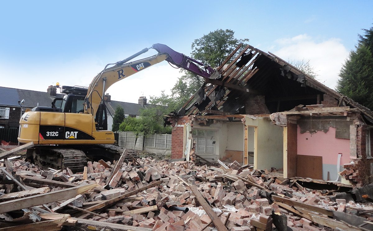 House demolition in Sheffield using bulldozer